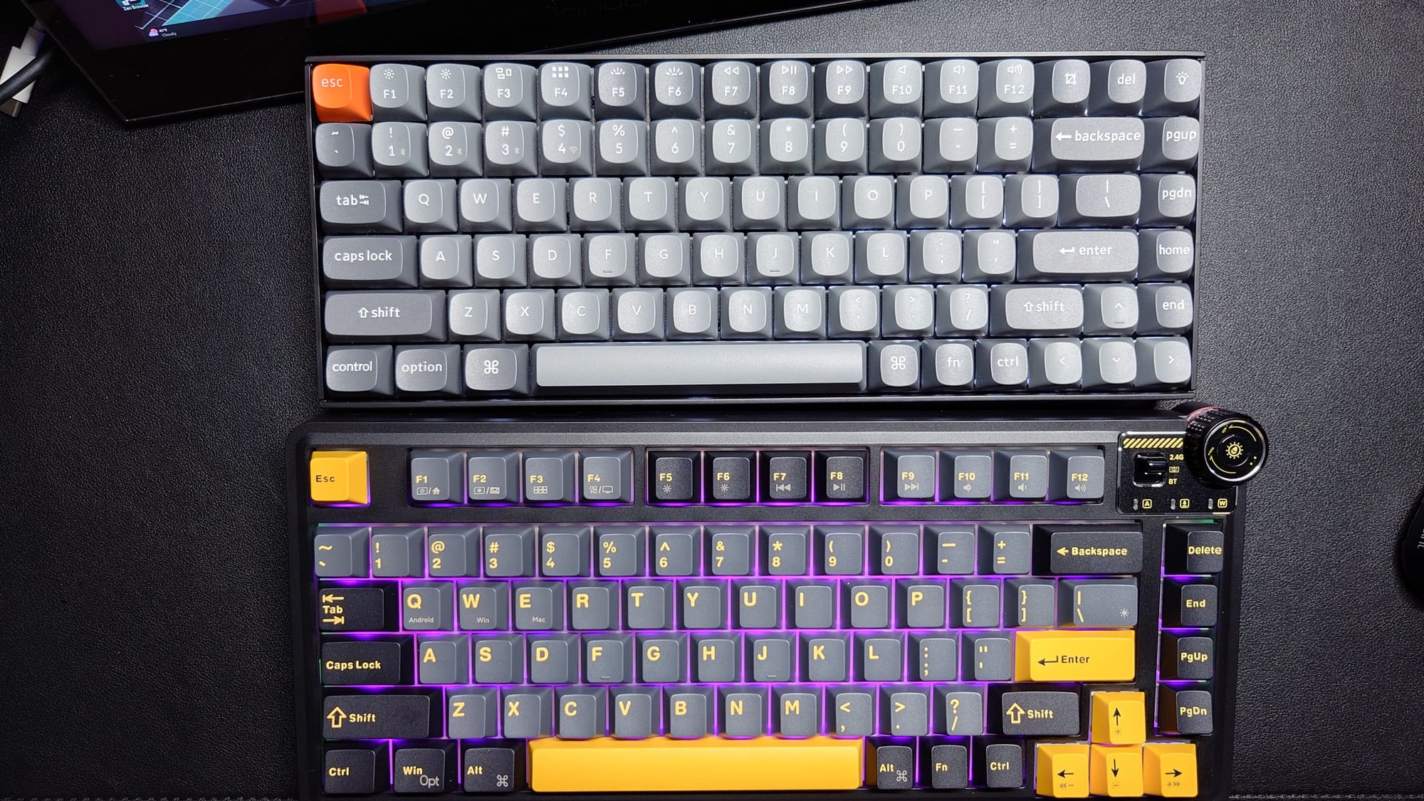 The Keychron keyboard is shown with the Aula.  The Aula is just a bit wider.  The Keychron lights up in white and the Aula in purple.