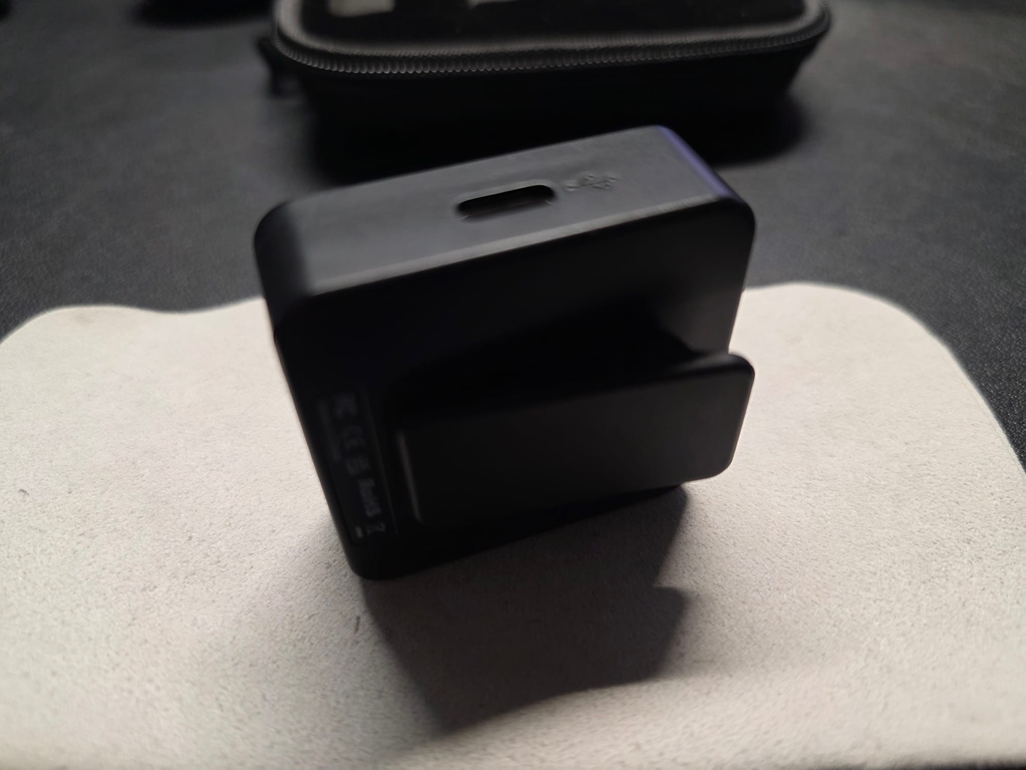 The Accessport Pro with USB C port displayed.  It is standing on its side on top of a white microfiber cloth on a black desk.