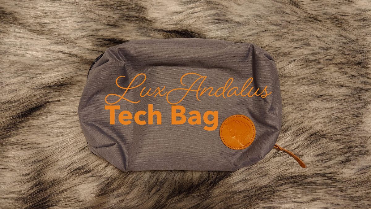 A picture of the LuxAndalus large tech bag, casually lounging on a faux fur background