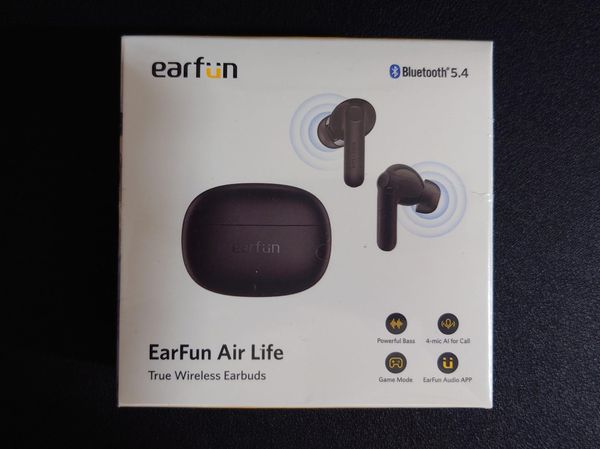 Photo of the box the earbuds come in, listing features such as 4 mics for calls, powerful bass, and audio app