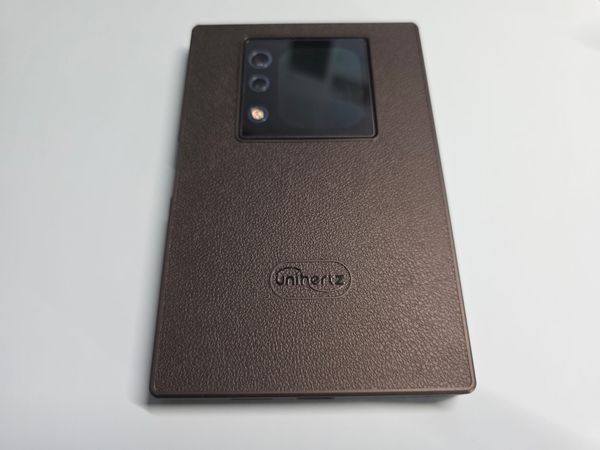 The Unihertz Titan 2 with rear screen facing up - the phone is lying face down on a white background