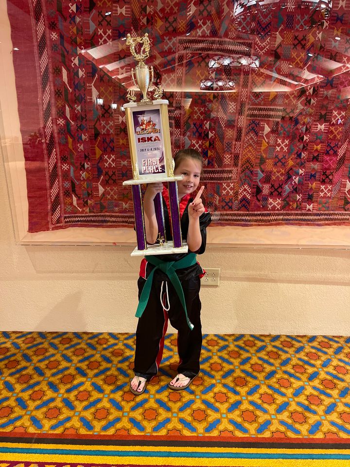 Incoming KSES second grader Sydney Jones holds her first place trophy at the U.S. Open for point sparring in her age group. / Kim McClanahan Hoard