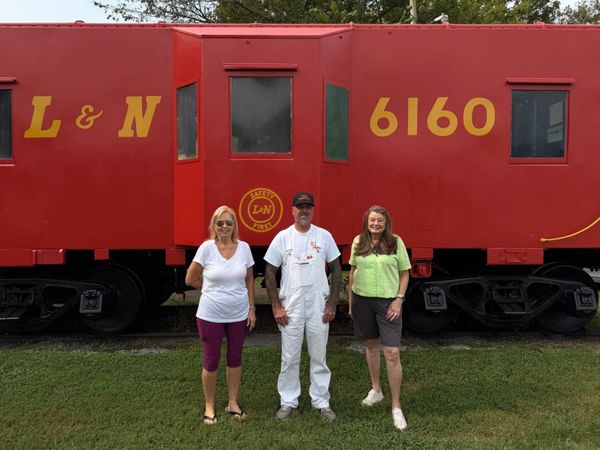 Pegram’s historic caboose gets a fresh coat of red