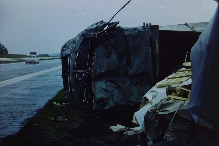 photo of an overturned vehicle on a wet road. https://archive.org/details/1_20220406_20220406_2244