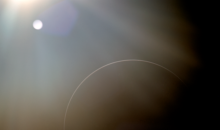 NASA photo from an Apollo mission, showing circular lens flares. 