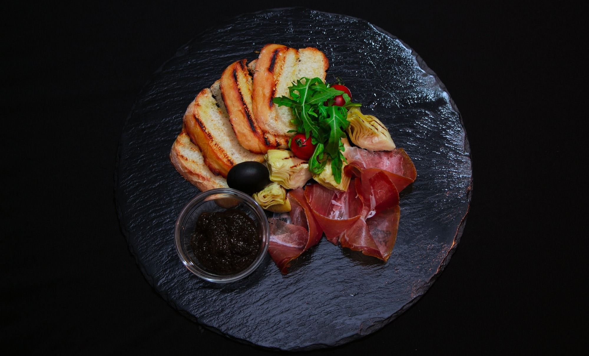 bread and iberico ham slices
