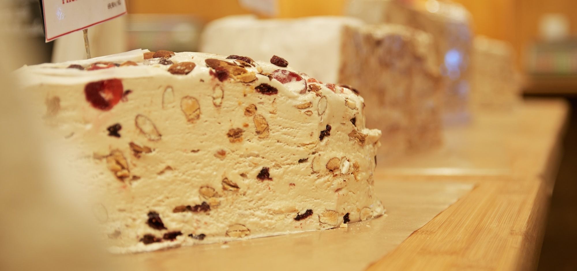 white and brown cake on brown wooden table