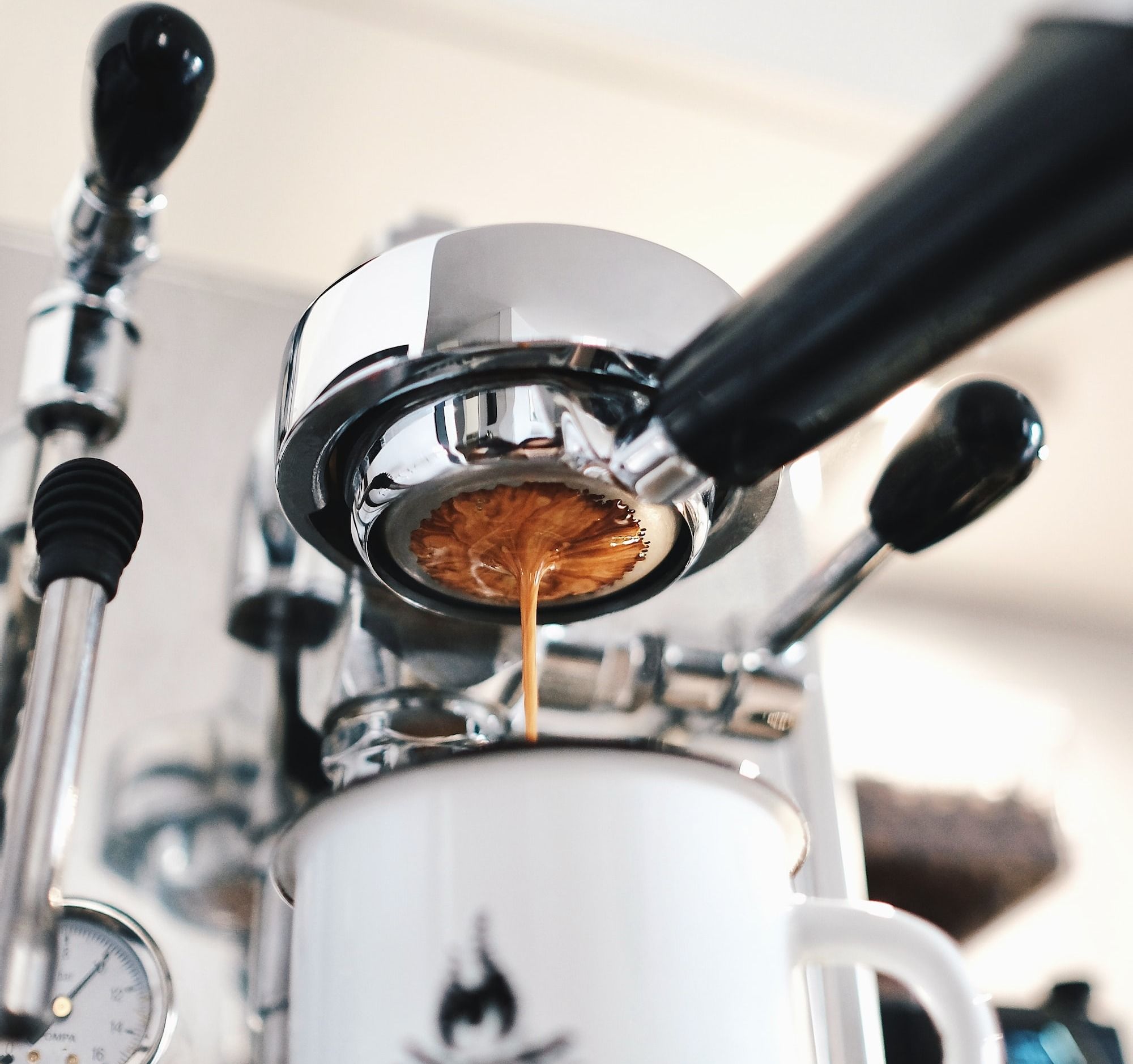 white ceramic mug with espresso
