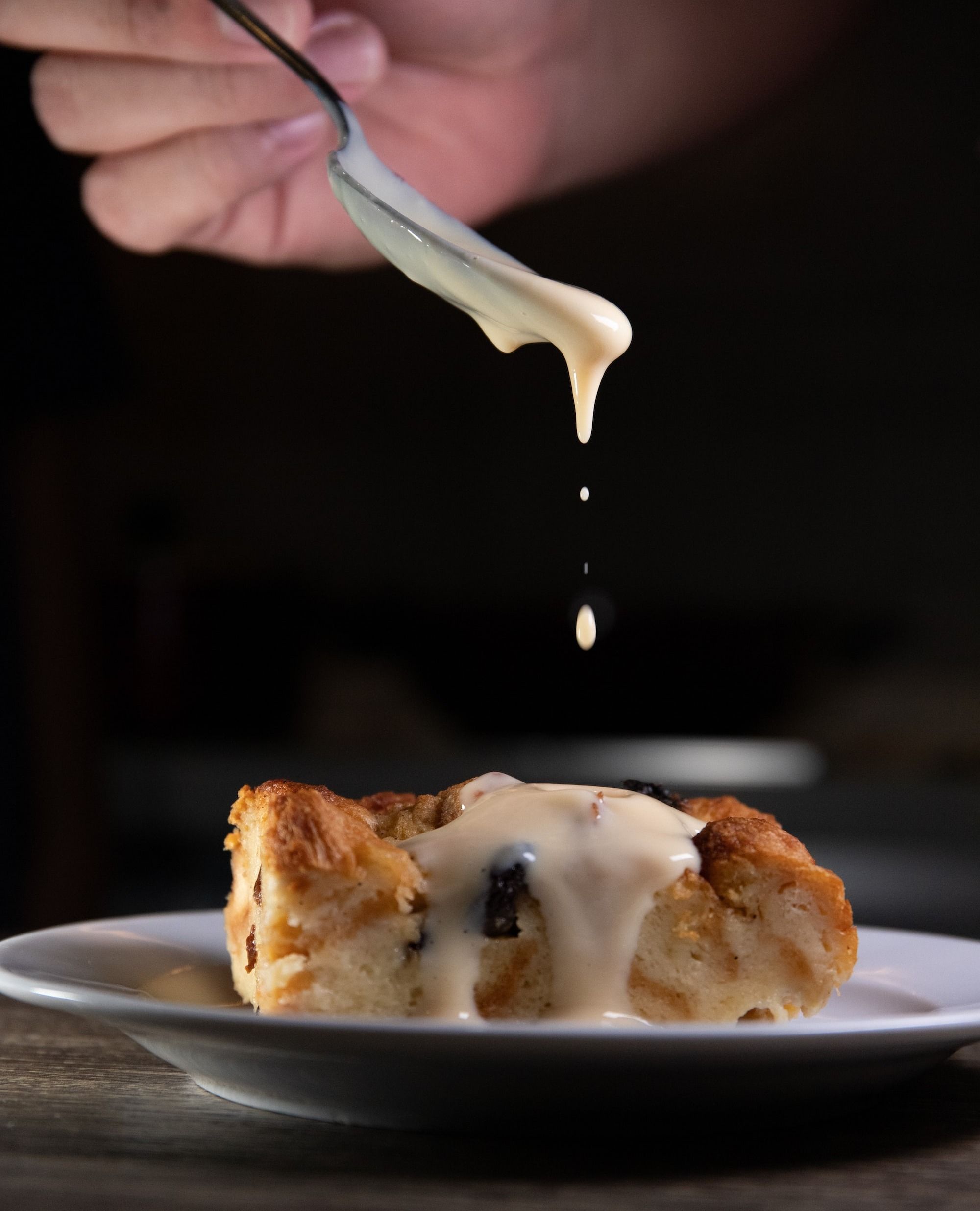 vanilla sauce on bread pudding