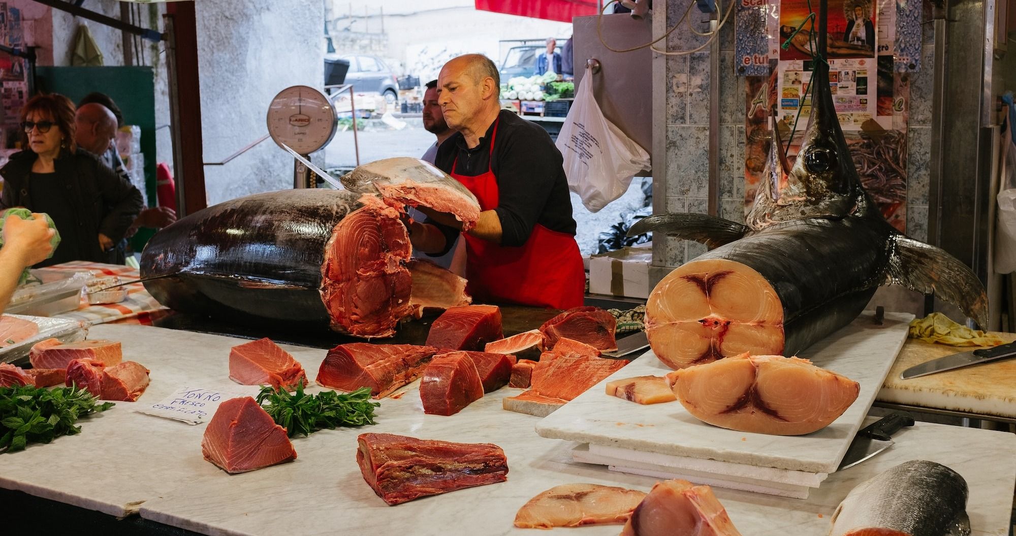 man slicing Tuna