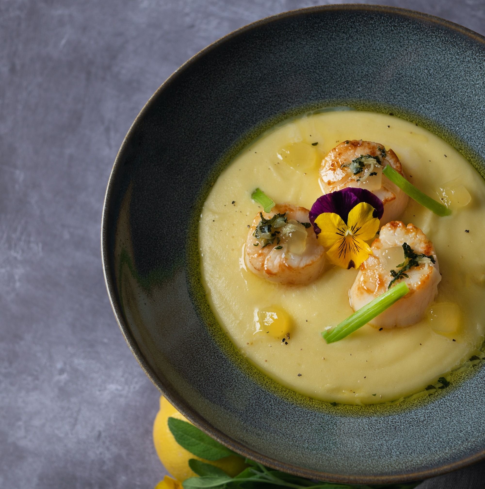 soup in black ceramic bowl