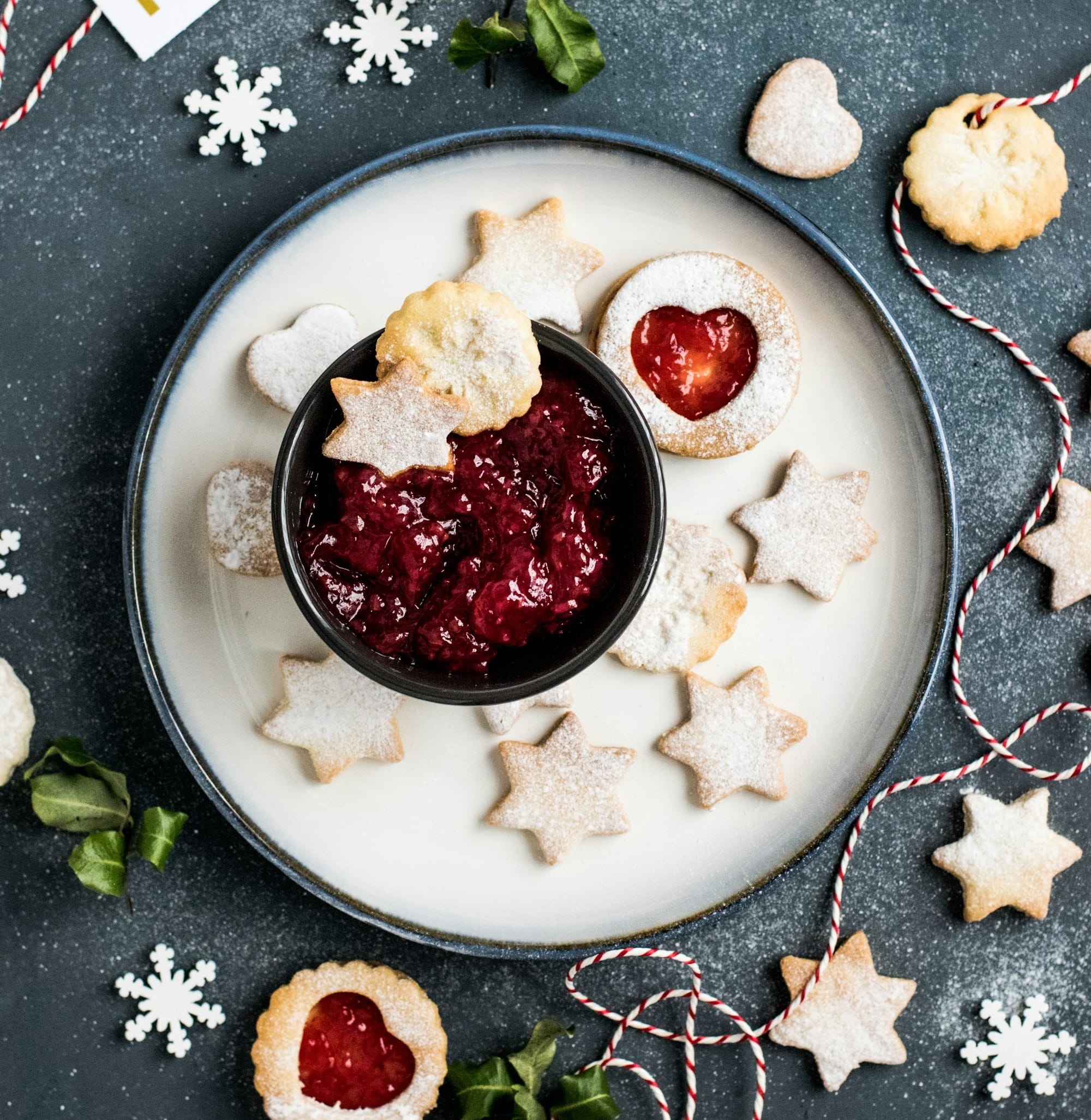 strawberry jam with star biscuits on plate