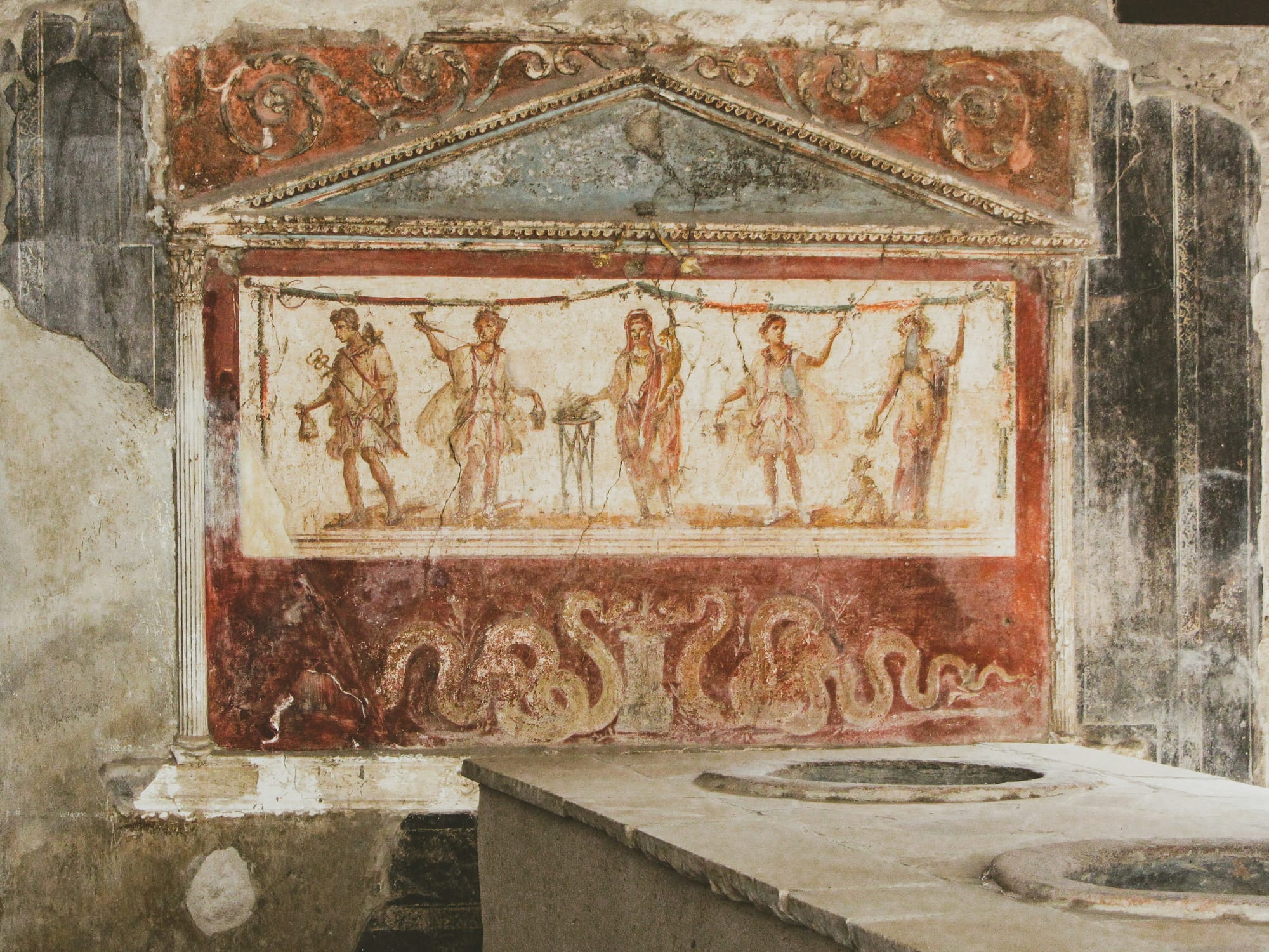 Vibrant red fresco from the Villa of the Mysteries in Pompeii.