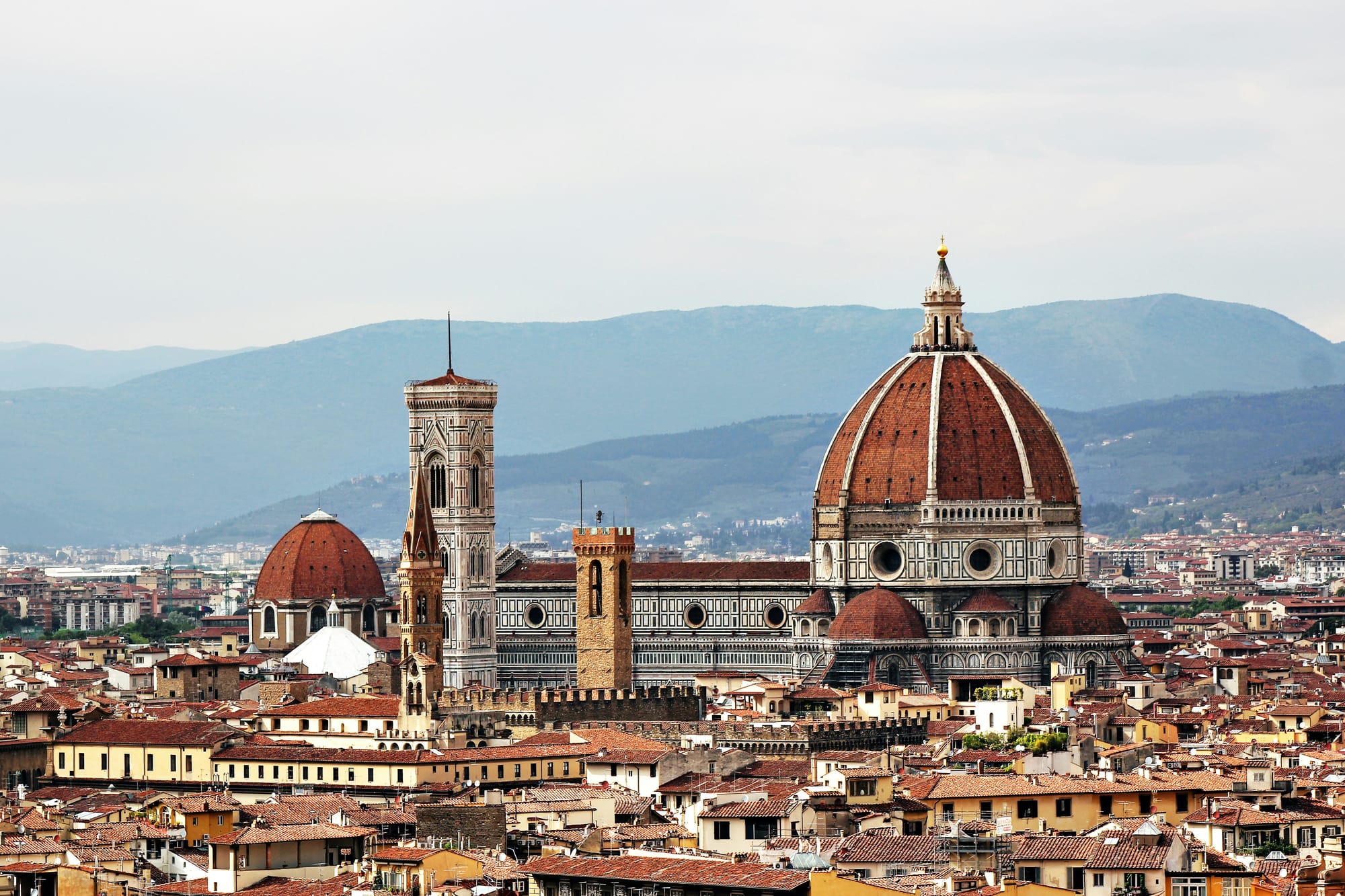 Panoramic view of the Florence skyline, with the Duomo's dome prominent.