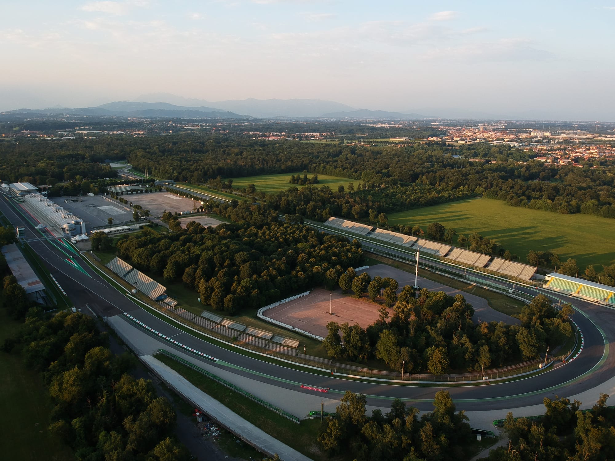 An aerial view of the famous Curva Parabolica at the Monza circuit, the historic racetrack for the Formula 1 Italian Grand Prix.