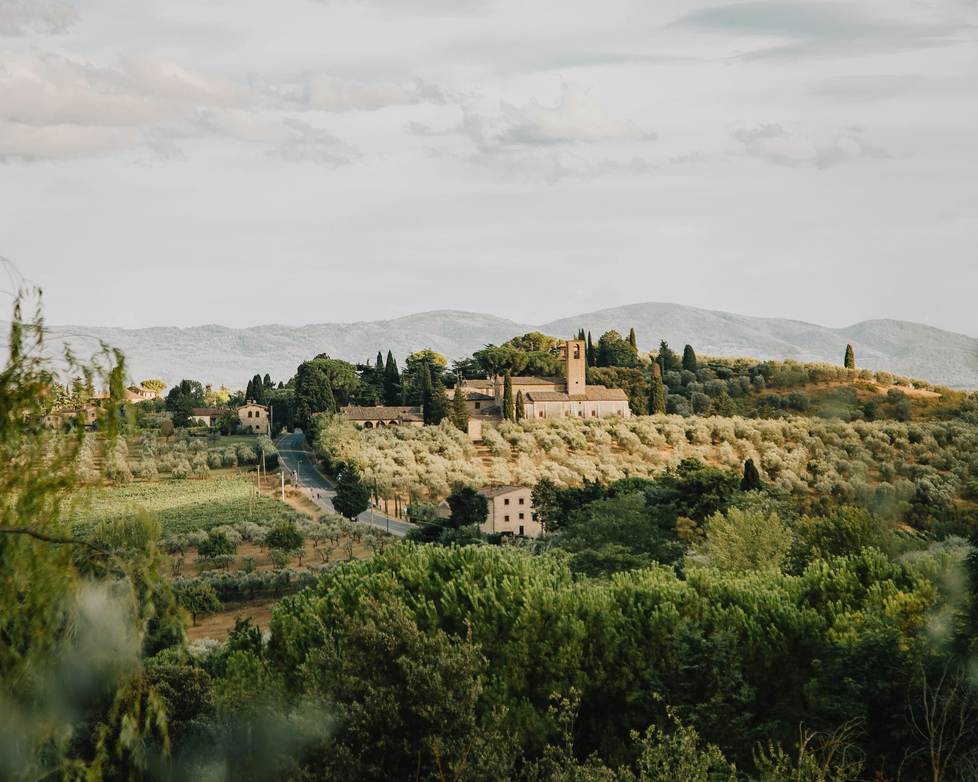 A scenic view of the Tuscan countryside around San Gimignano, near Siena, one of the highlights of any road trip.