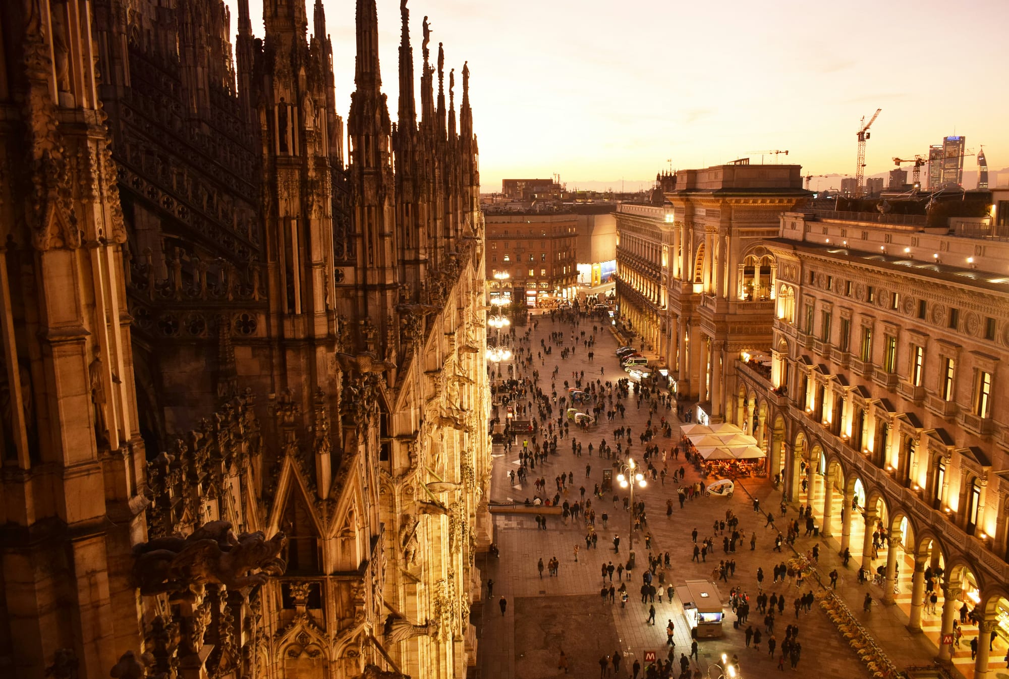 Sunset view over the intricate Gothic spires of the Duomo di Milano, a key architectural masterpiece in Milan, one of Italy's top art cities.