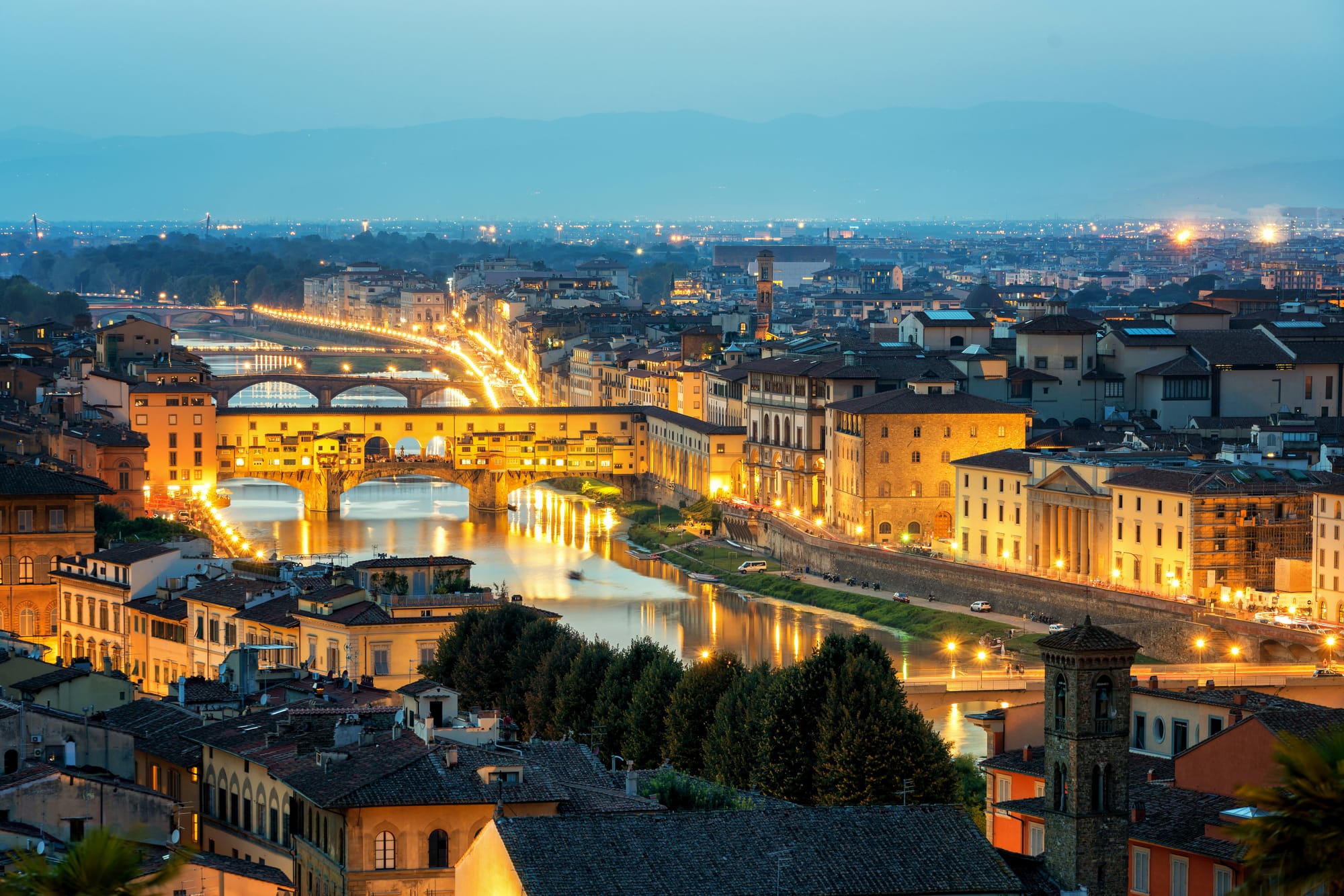Ponte Vecchio bridge over the Arno River in Florence, a top art city in Tuscany, Italy.