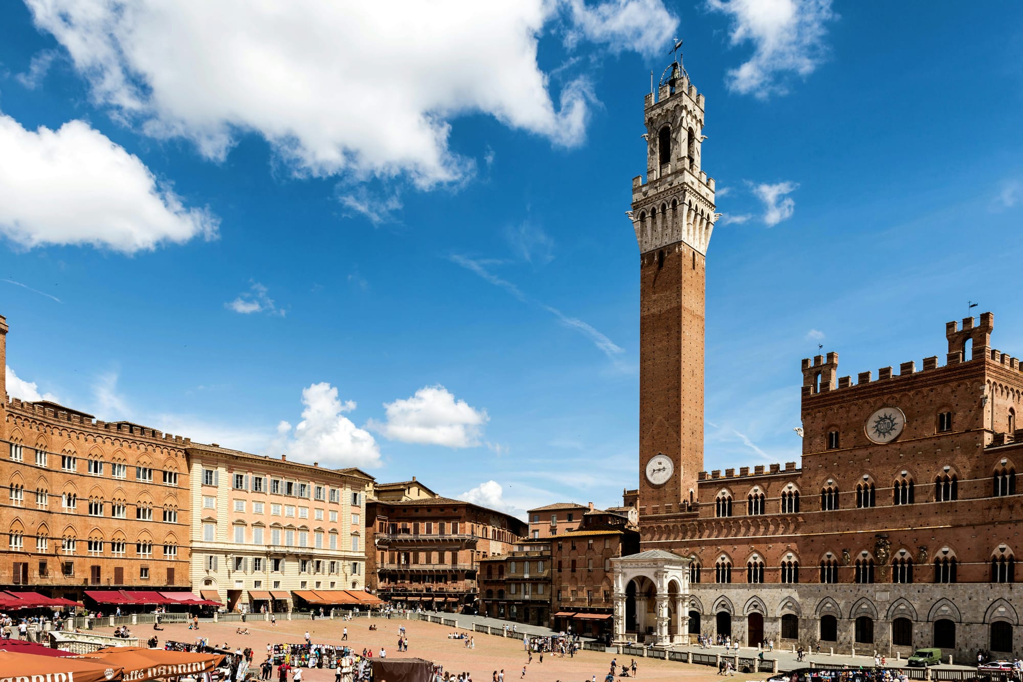 The unique, shell-shaped Piazza del Campo in Siena, with the Torre del Mangia in the background.