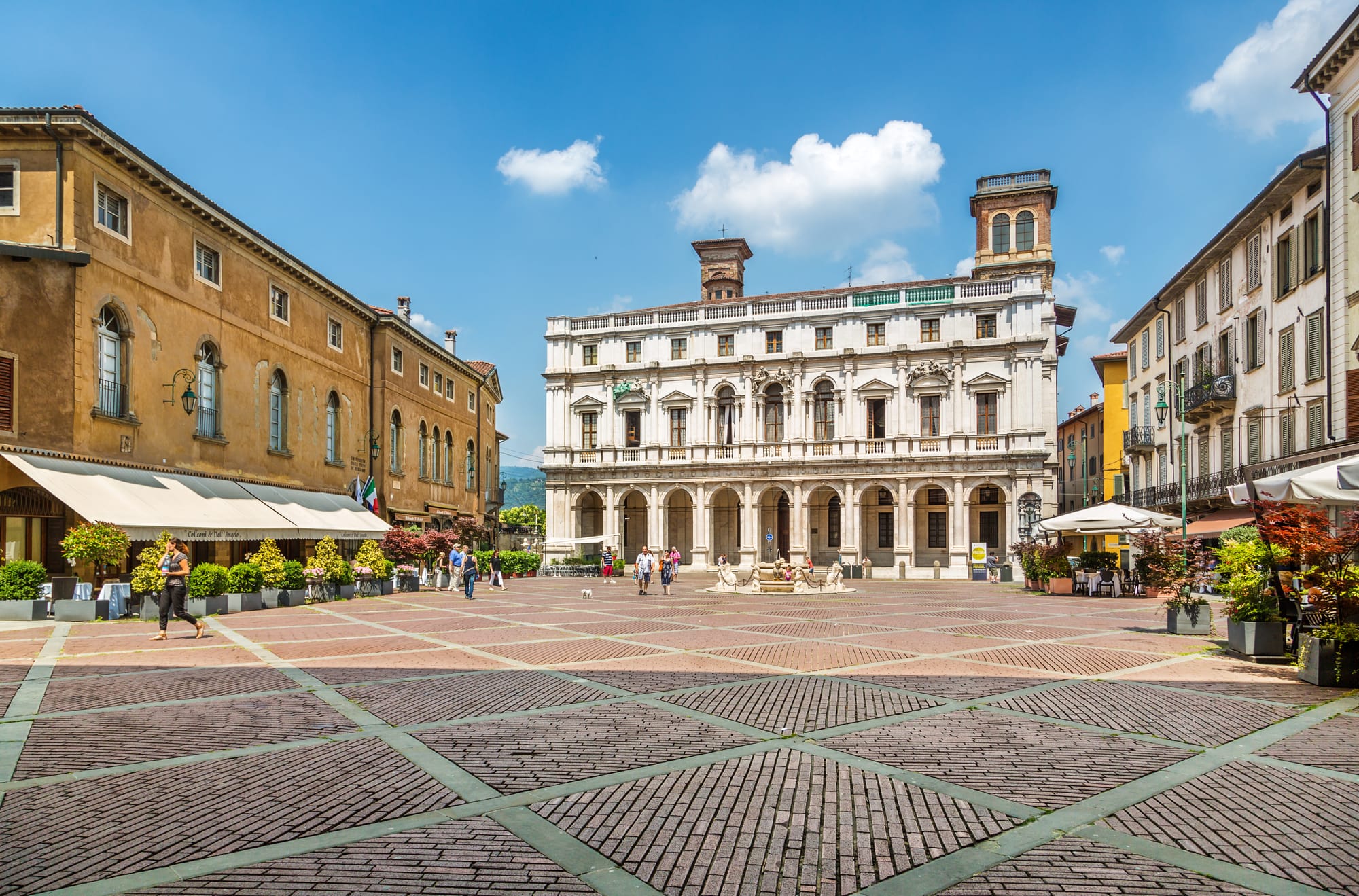 The white marble facade of the Palazzo Nuovo in Piazza Vecchia, Bergamo, which houses the historic Angelo Mai Civic Library.