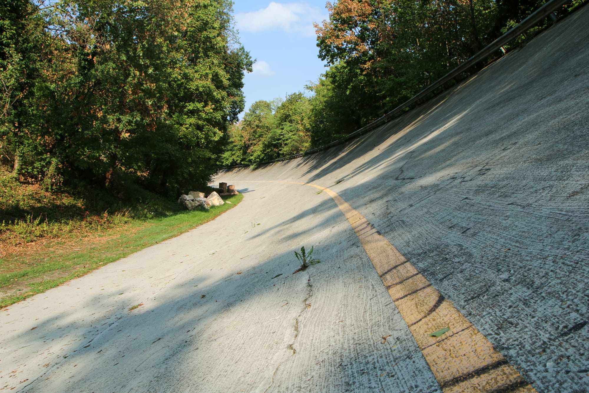 Detail shot of the weathered and steep concrete banking of the historic sopraelevata oval at the Monza circuit.