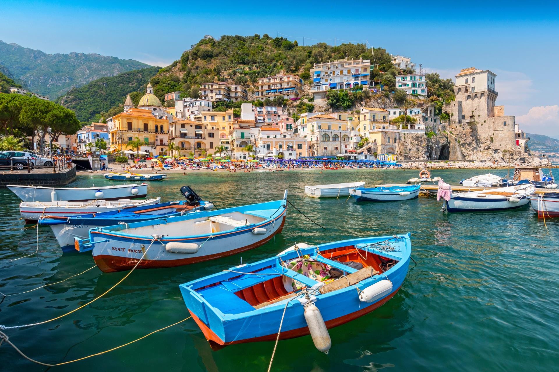 Traditional leisure boats and colorful buildings in the small fishing harbor of Cetara on the Amalfi Coast.