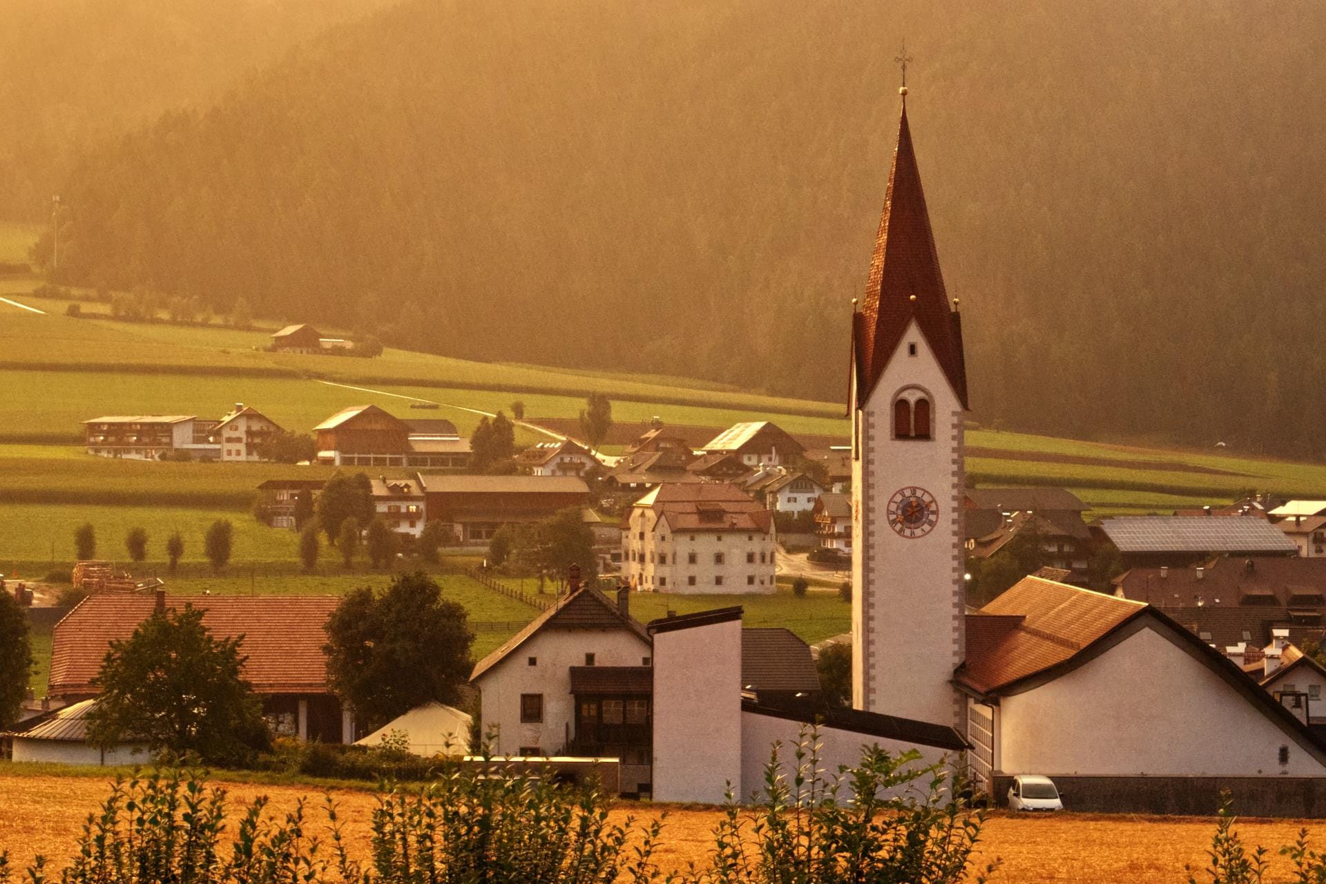 The alpine village of Rasun di Sopra at sunrise during the autumn season in the Anterselva valley.