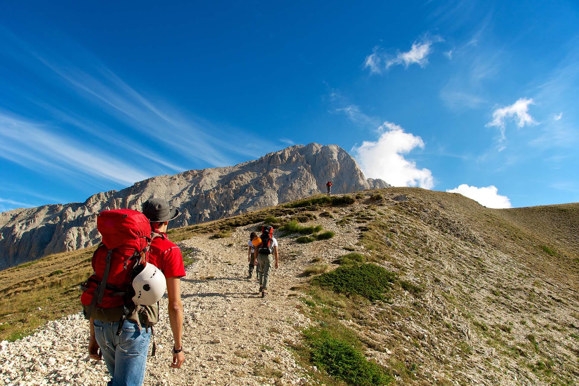 Alpinists climbing Corno Grande, the highest peak of the Apennines at 2,912 meters, Gran Sasso e Monti della Laga National Park, Abruzzo, Italy