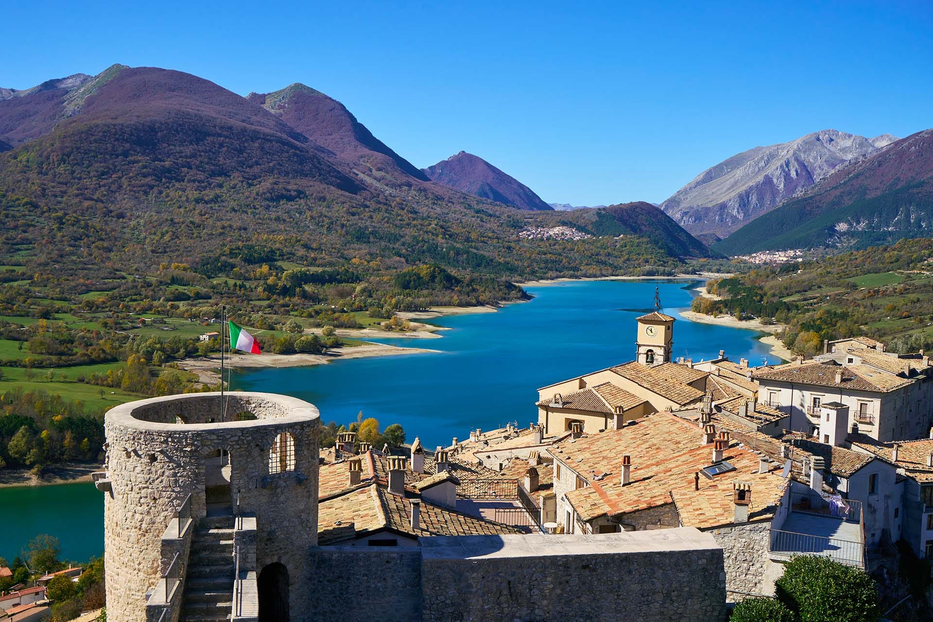 Scenic view of Lake Barrea surrounded by forested mountains in Abruzzo, Lazio e Molise National Park, central Apennines, Italy.