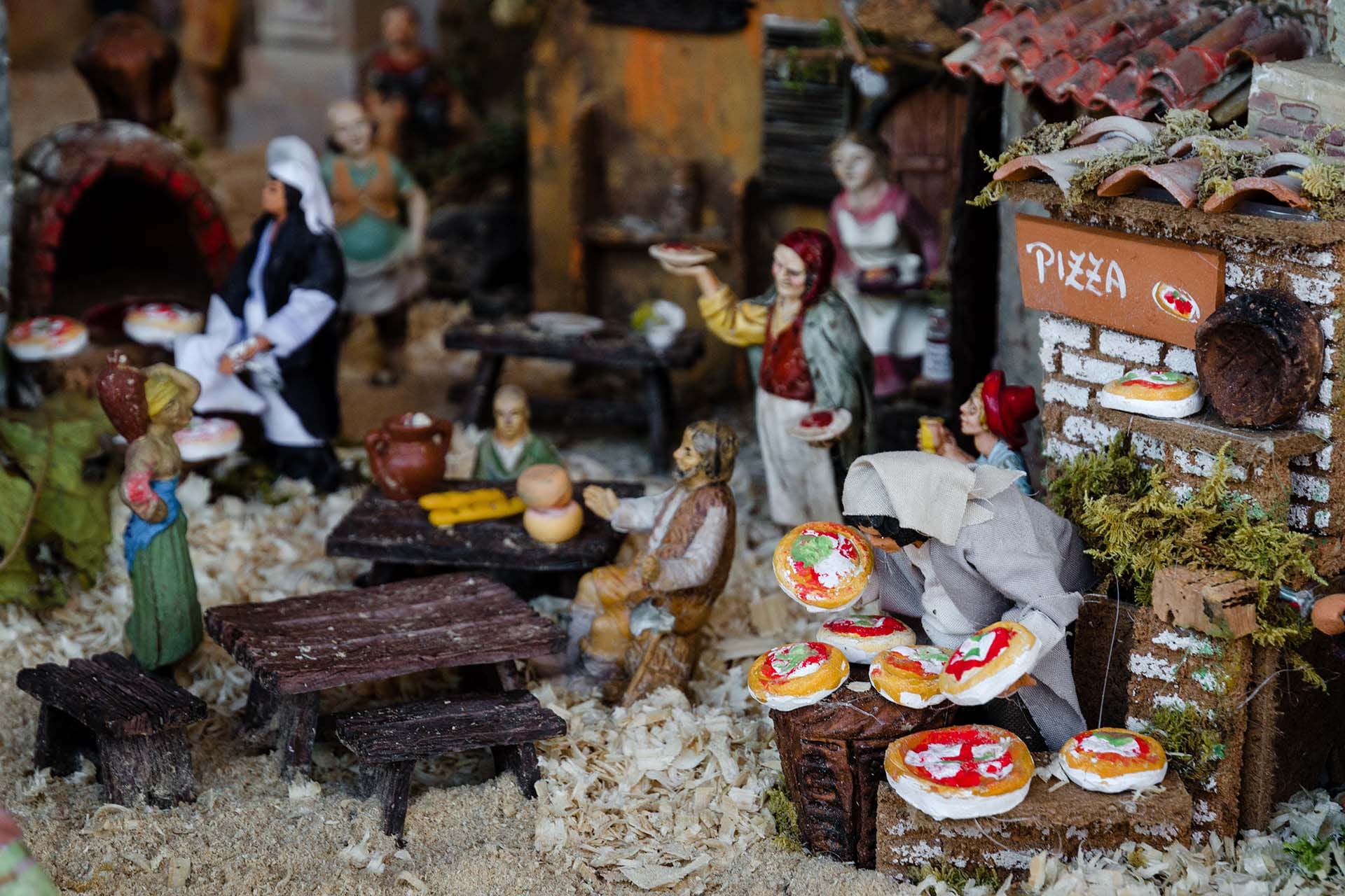 Handcrafted Neapolitan pizza maker figurine in a traditional Italian presepe from San Gregorio Armeno, Naples