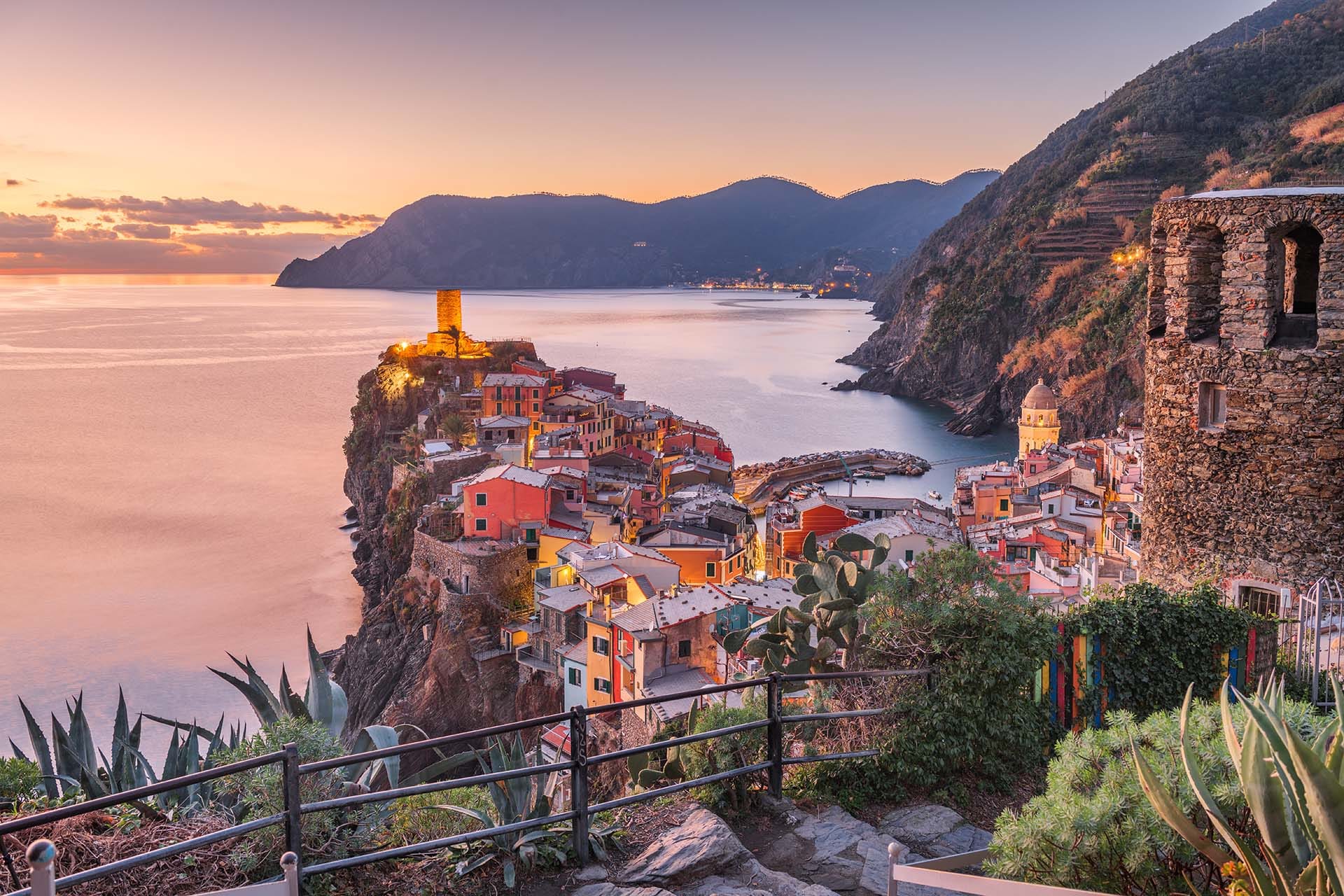 Panoramic view of Vernazza village at sunset, Cinque Terre National Park, Ligurian coast, Italy.