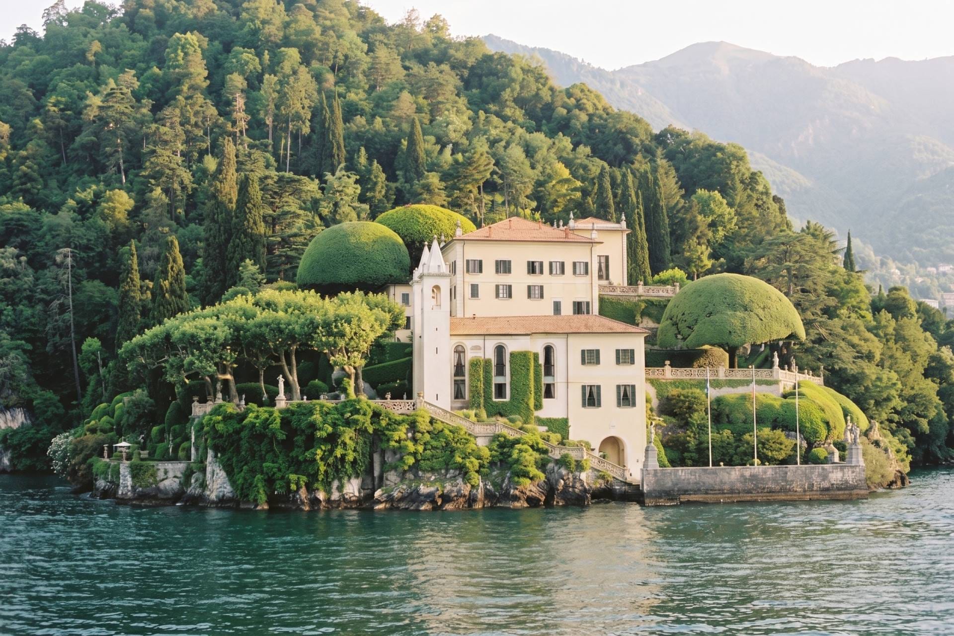 Villa del Balbianello with loggia and topiary on a wooded promontory at Lenno, Lake Como