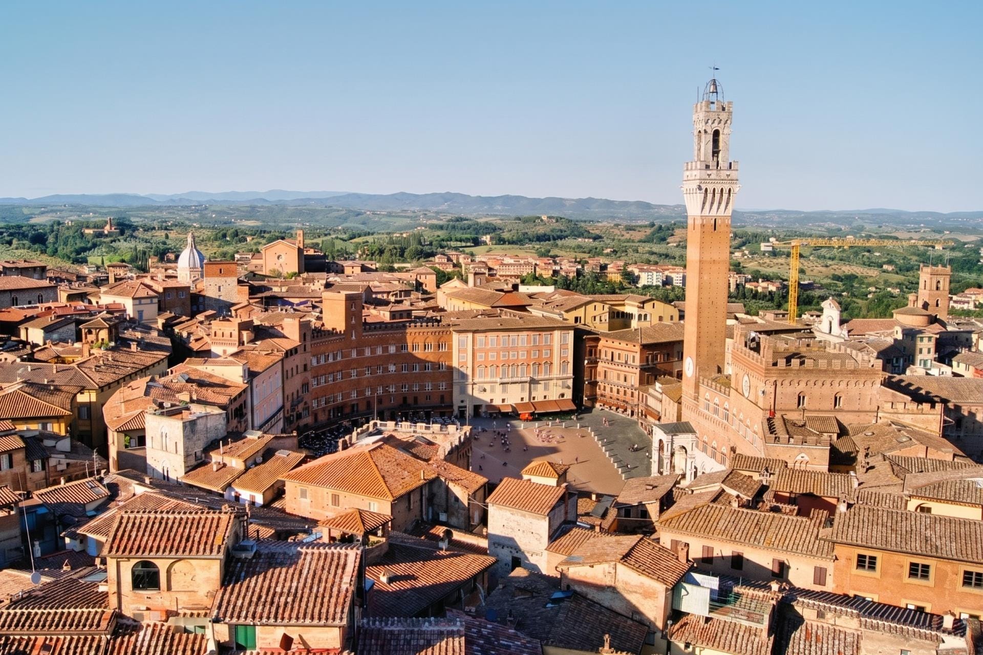 Torre del Mangia and Piazza del Campo above the Siena rooftops, home of the Palio di Siena