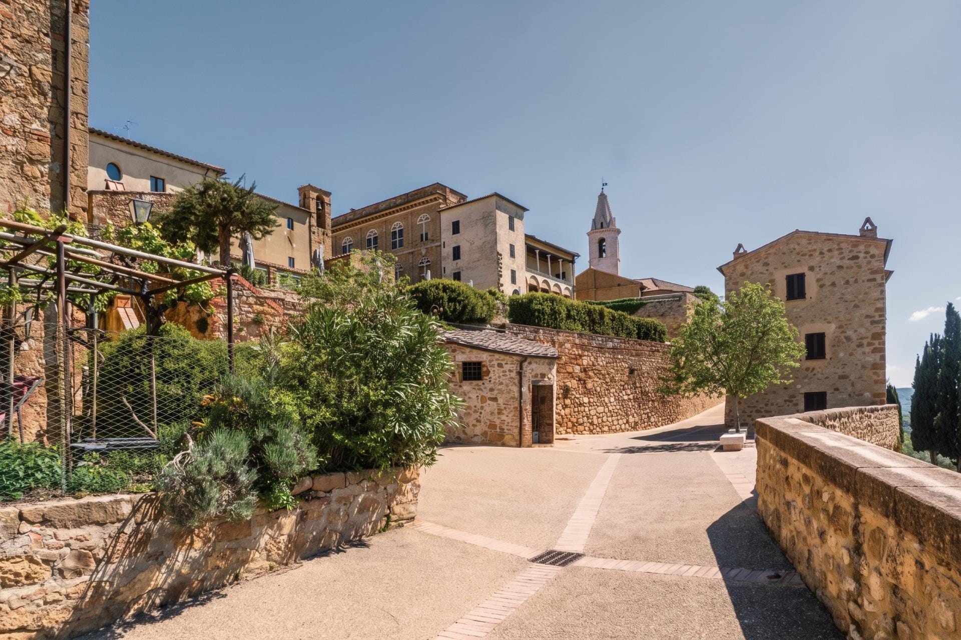 Stone houses and bell tower of Pienza above the Val d'Orcia, a countryside base near Siena for the Palio