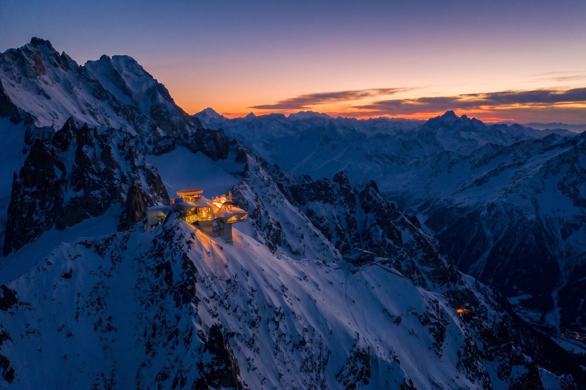 Skyway Monte Bianco summit station at Punta Helbronner lit at blue hour above the massif
