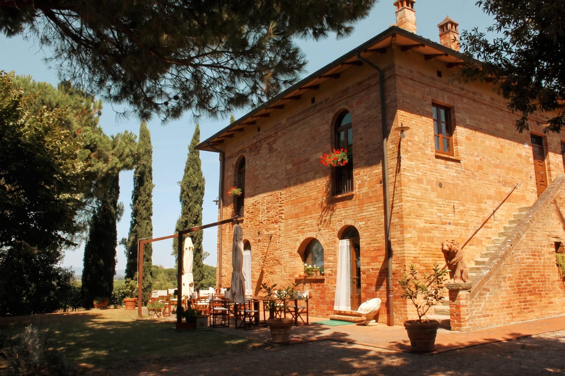 Restored brick podere with terrace and cypresses, where to stay in Val d'Orcia
