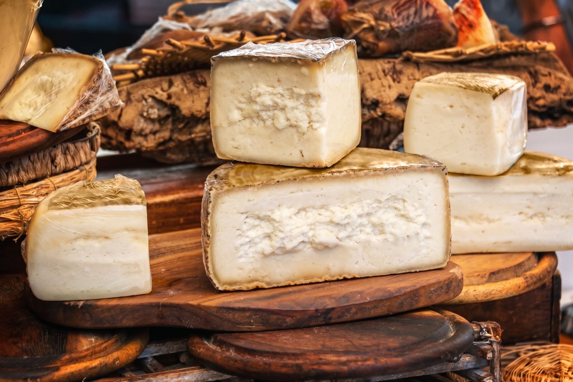 Wheels of pecorino di Pienza on a market stall, Val d'Orcia