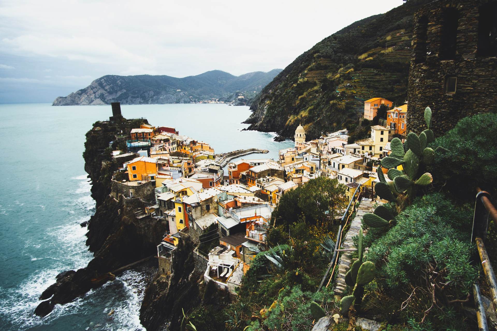 The Doria Castle tower above Vernazza's colorful harbor in Liguria's Cinque Terre