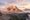 Tre Cime di Lavaredo lit by alpenglow above a sea of cloud, the Dolomites in summer