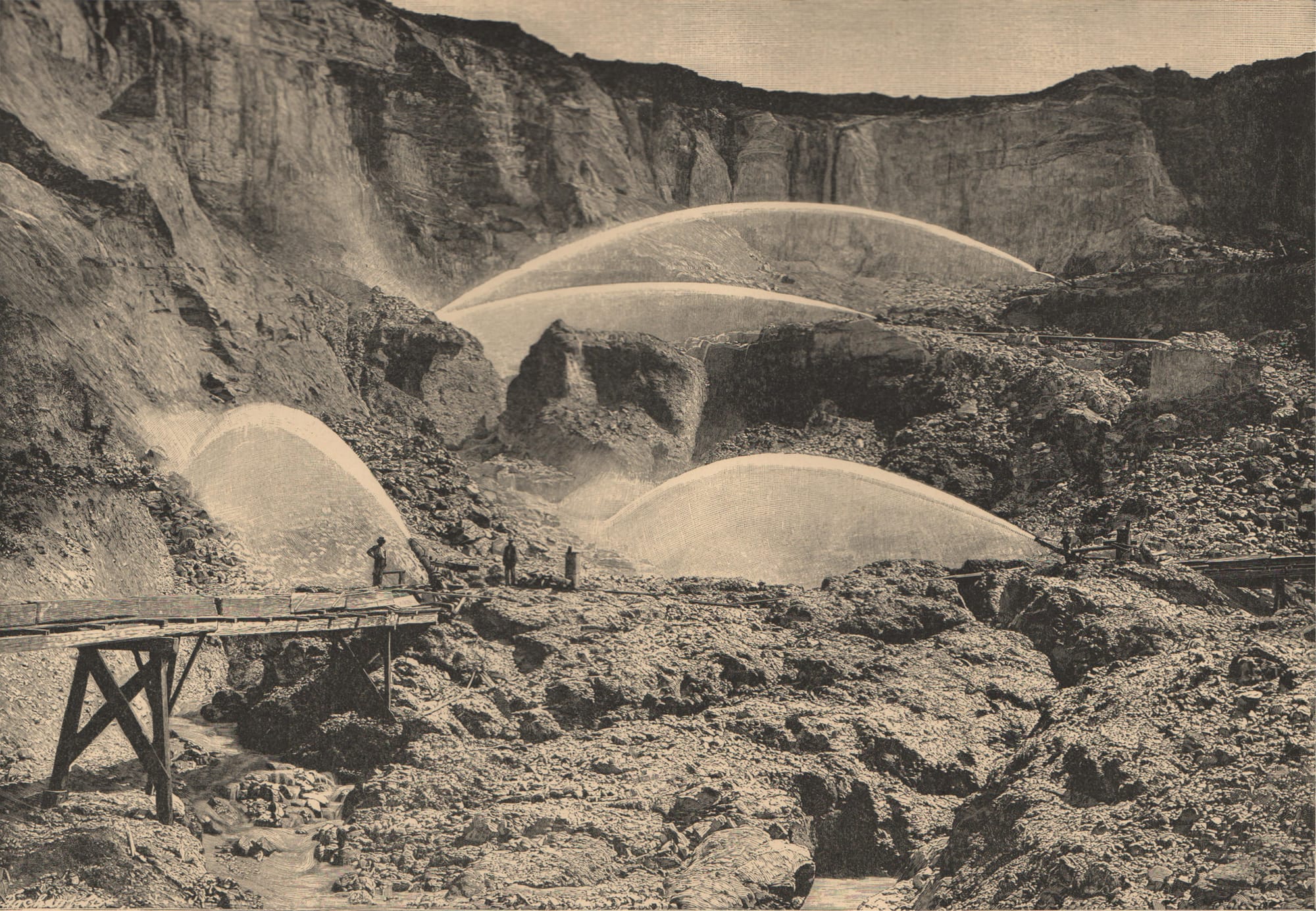 Historic photo (c.1880) of hydraulic mining at Malakoff Diggins, CA. Multiple water cannons blast hillsides while miners work on wooden trestles.