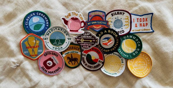 A collection of embroidered patches from Camp Chateau.