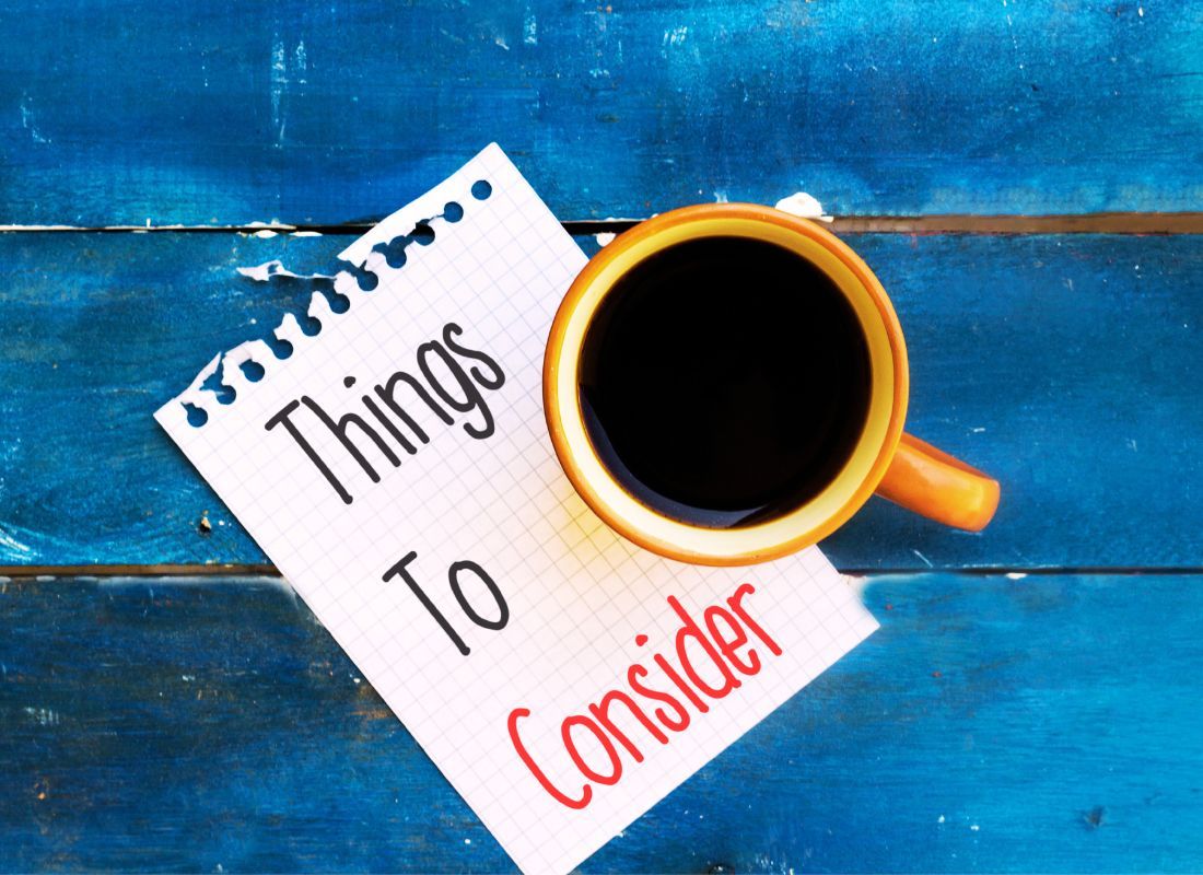 A picture of a person considering different factors when choosing a little league pitching machine