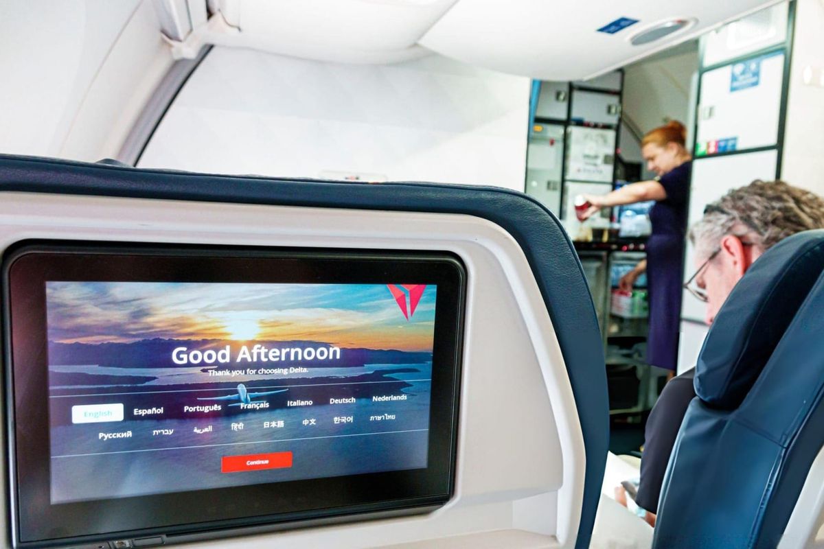 Delta Airlines, touch-screen digital entertainment system on seatback.