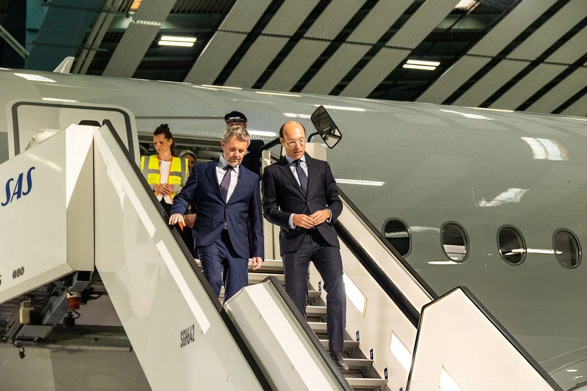 King Frederik X of Denmark and Anko van der Werff, President and CEO of SAS, are in the cockpit during the naming ceremony of a new Airbus A350