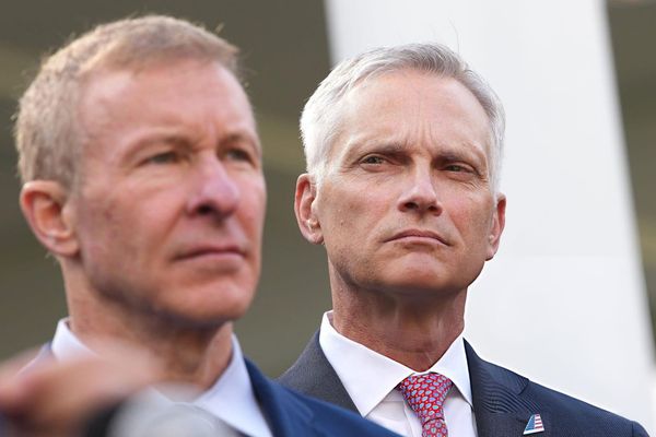 United Airlines CEO Scott Kirby (L) and American Airlines CEO Robert Isom listen as Vice President JD Vance speaks to reporters outside the White House on October 30, 2025