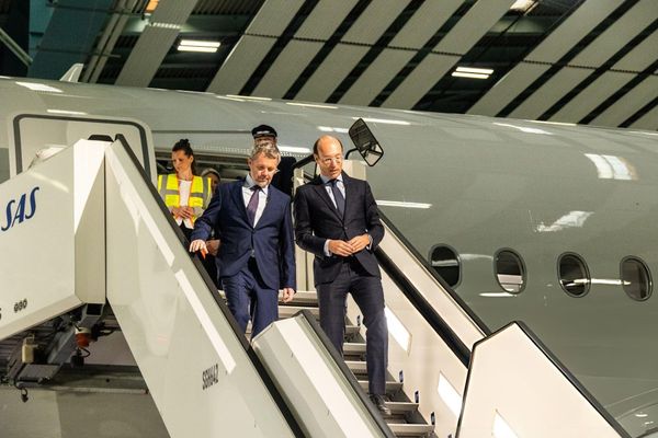King Frederik X of Denmark and Anko van der Werff, President and CEO of SAS, are in the cockpit during the naming ceremony of a new Airbus A350