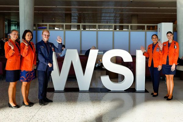 Jetstar Airways staff pose for the photo at the terminal during the commencement of passenger operations at Western Sydney International Airport on October 25, 2026 in Sydney, Australia. 