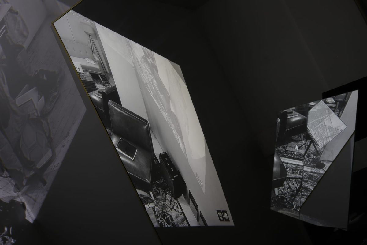 A digital photograph showing the interior of artist-researcher Wyatt Coday's studio reflected mirrors and video cameras.