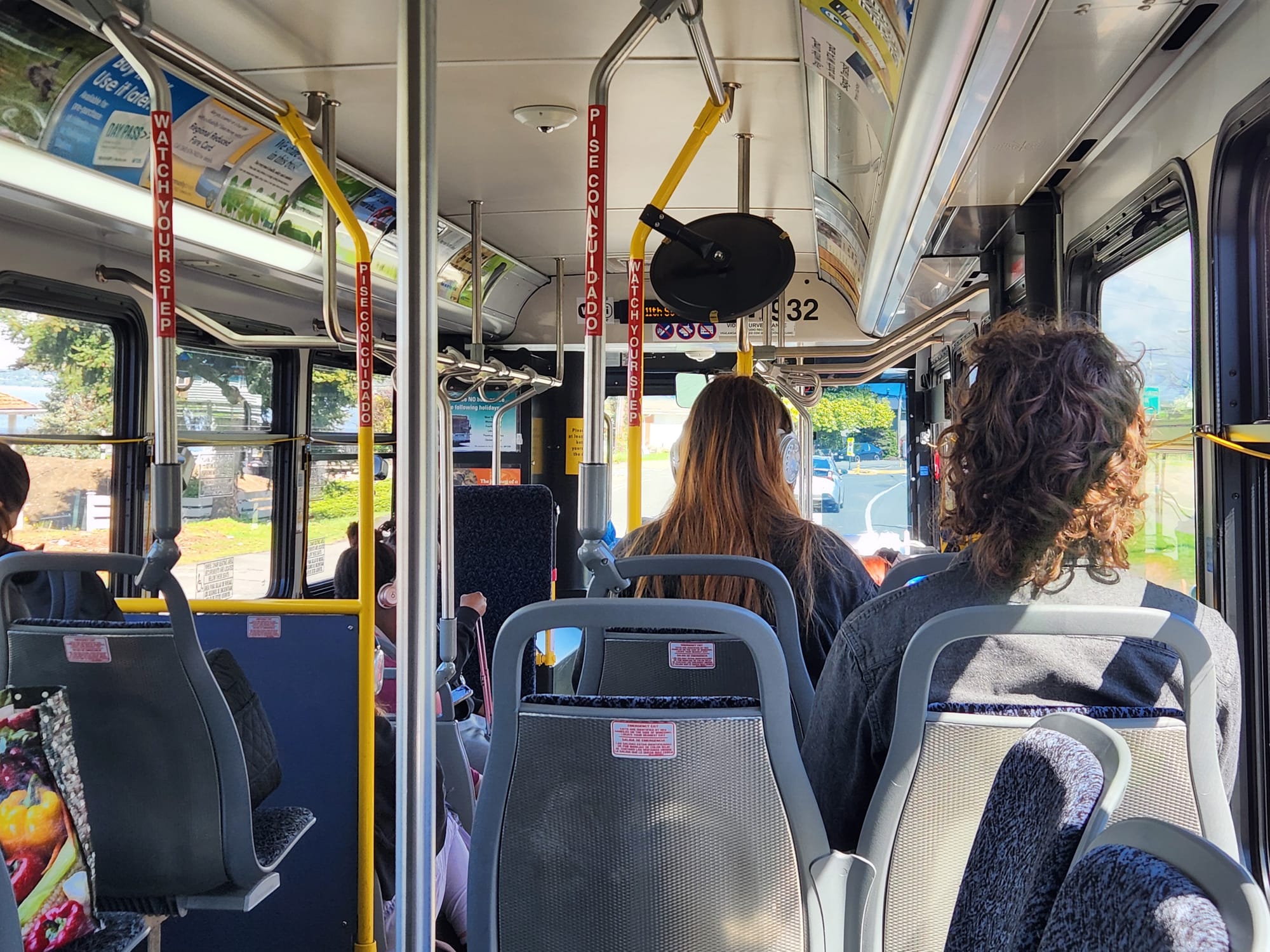 A look at the interior of a Route 1 bus with passengers facing forward.