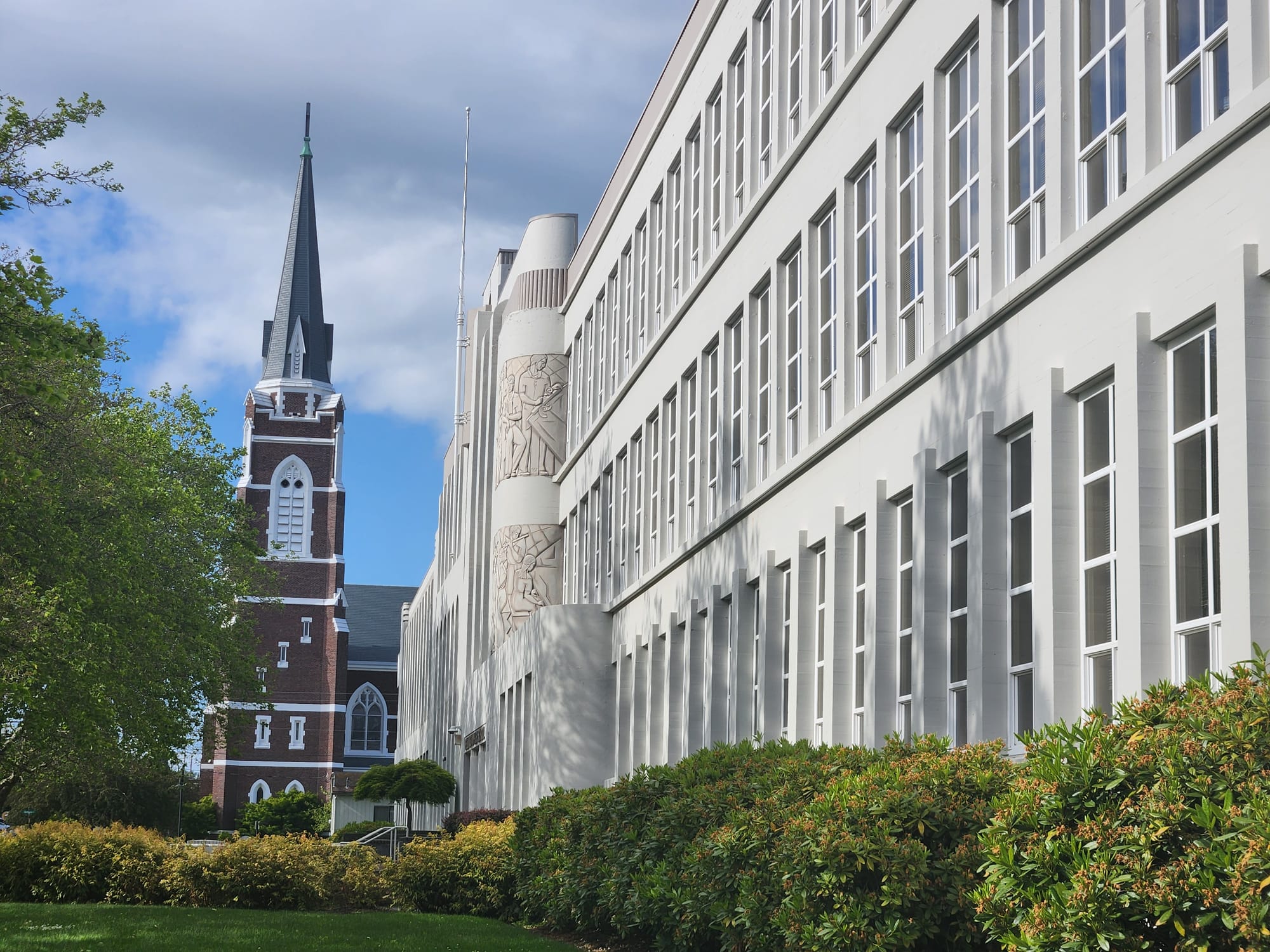 Bellingham High School's west front with a church steeple in the background.